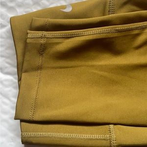 Brand new olive green Nike leggings. Size small.
